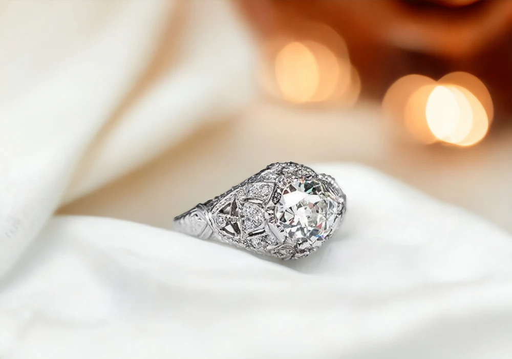 A dazzling white gold ring with a magnificent diamond centerpiece, perfect for those seeking elegant vintage charm reminiscent of 1920s wedding rings.