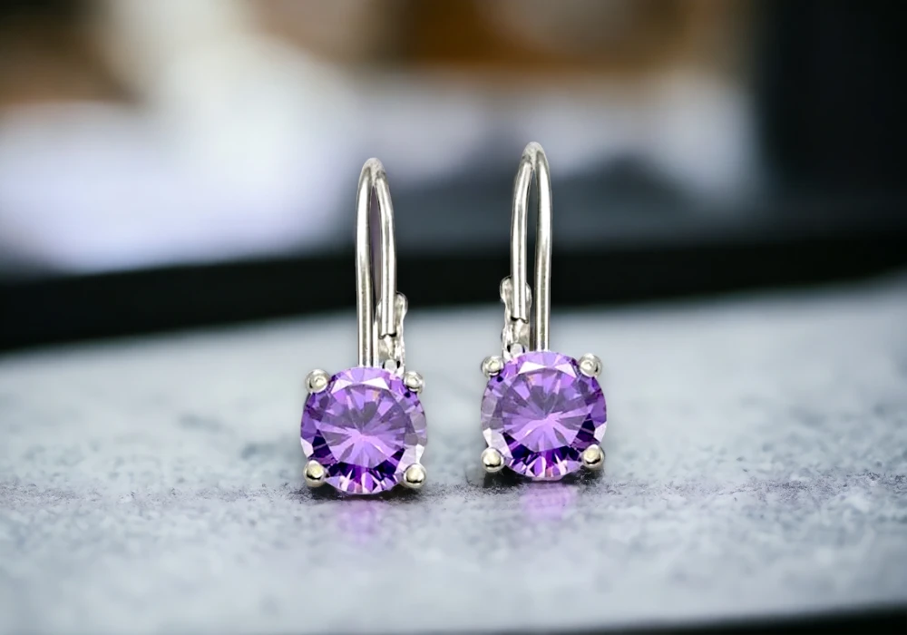 Amethyst drop earrings in sterling silver, conveying the significant Amethyst meaning.